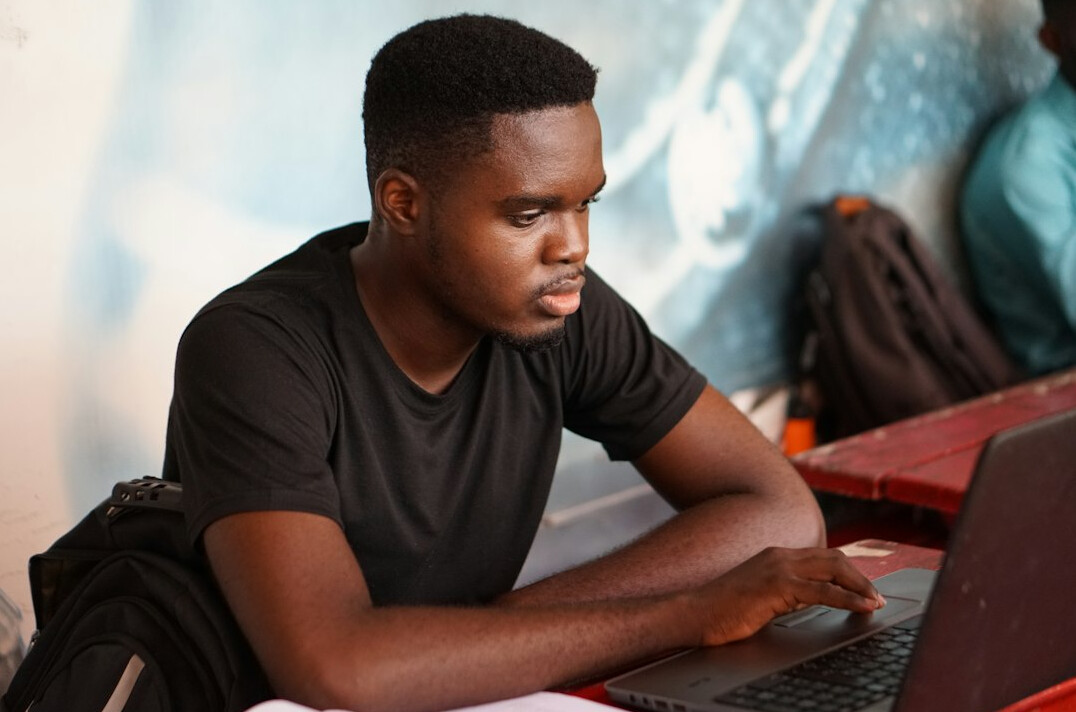 diverse students learning programming in english