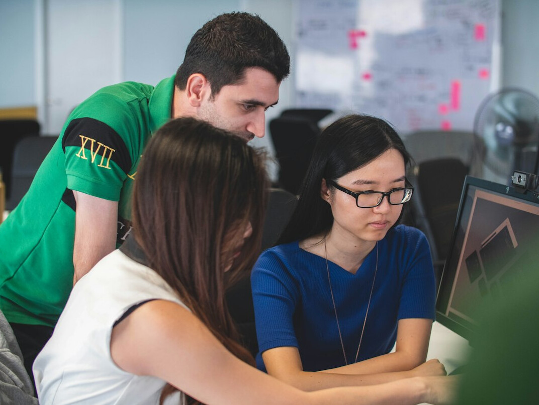 group of students coding together