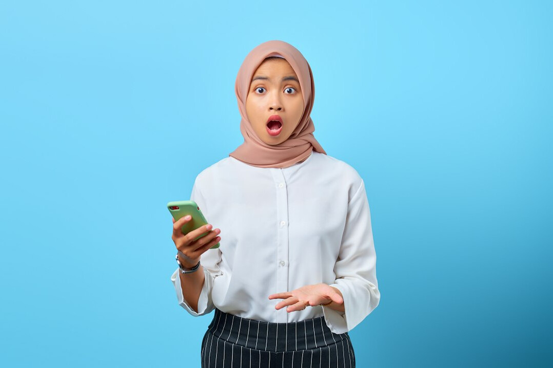Studio portrait of a professional Malay woman software engineer